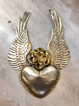 Winged heart with a flower
