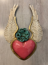 Winged heart with a flower