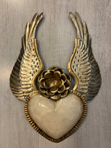 Winged heart with a flower