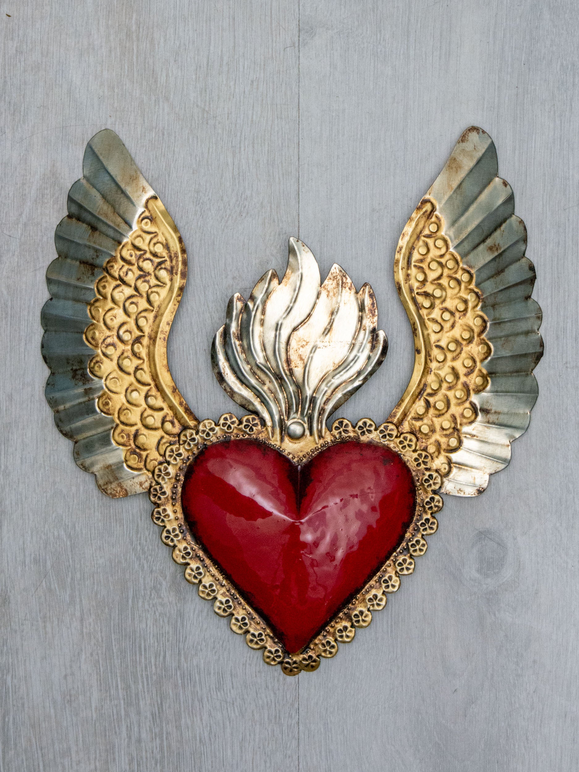 Winged heart a flame with flowers