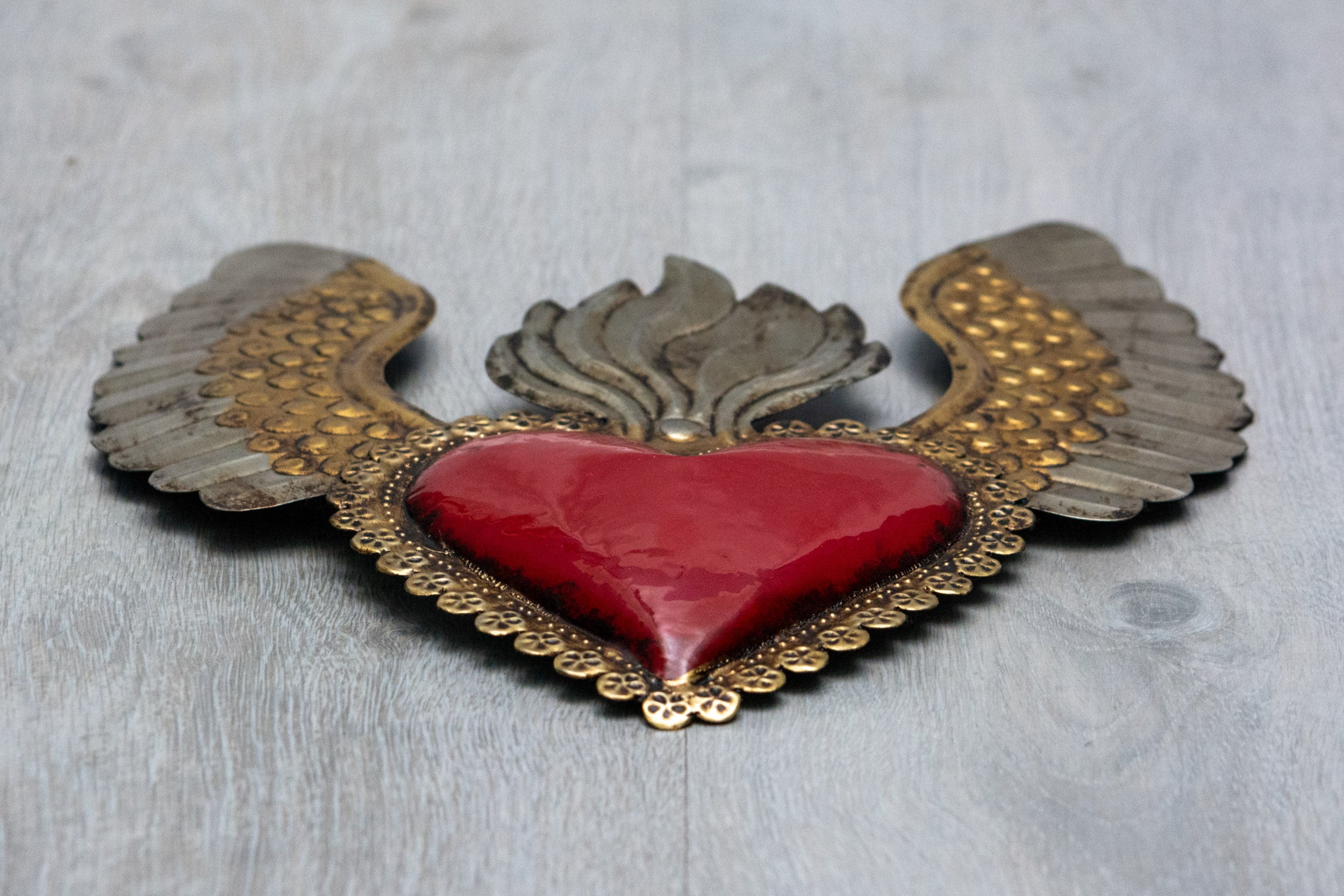Winged heart a flame with flowers