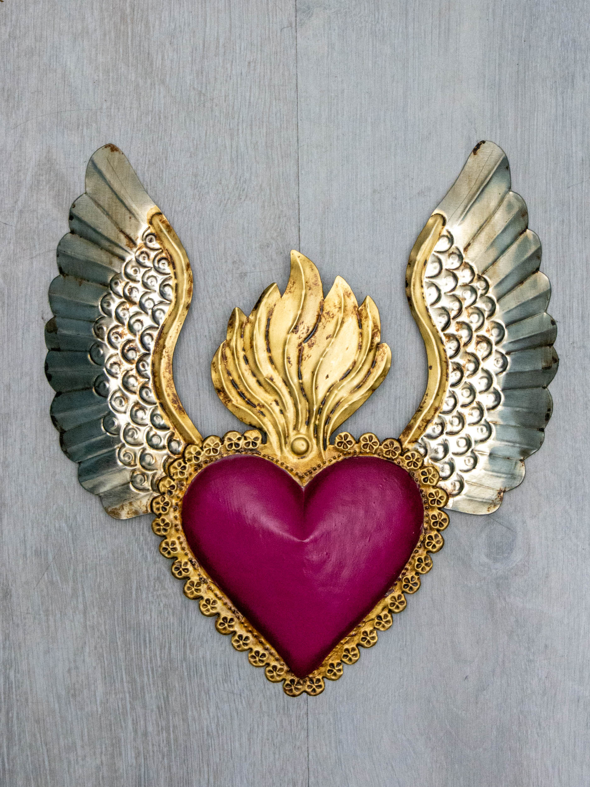 Winged heart a flame with flowers