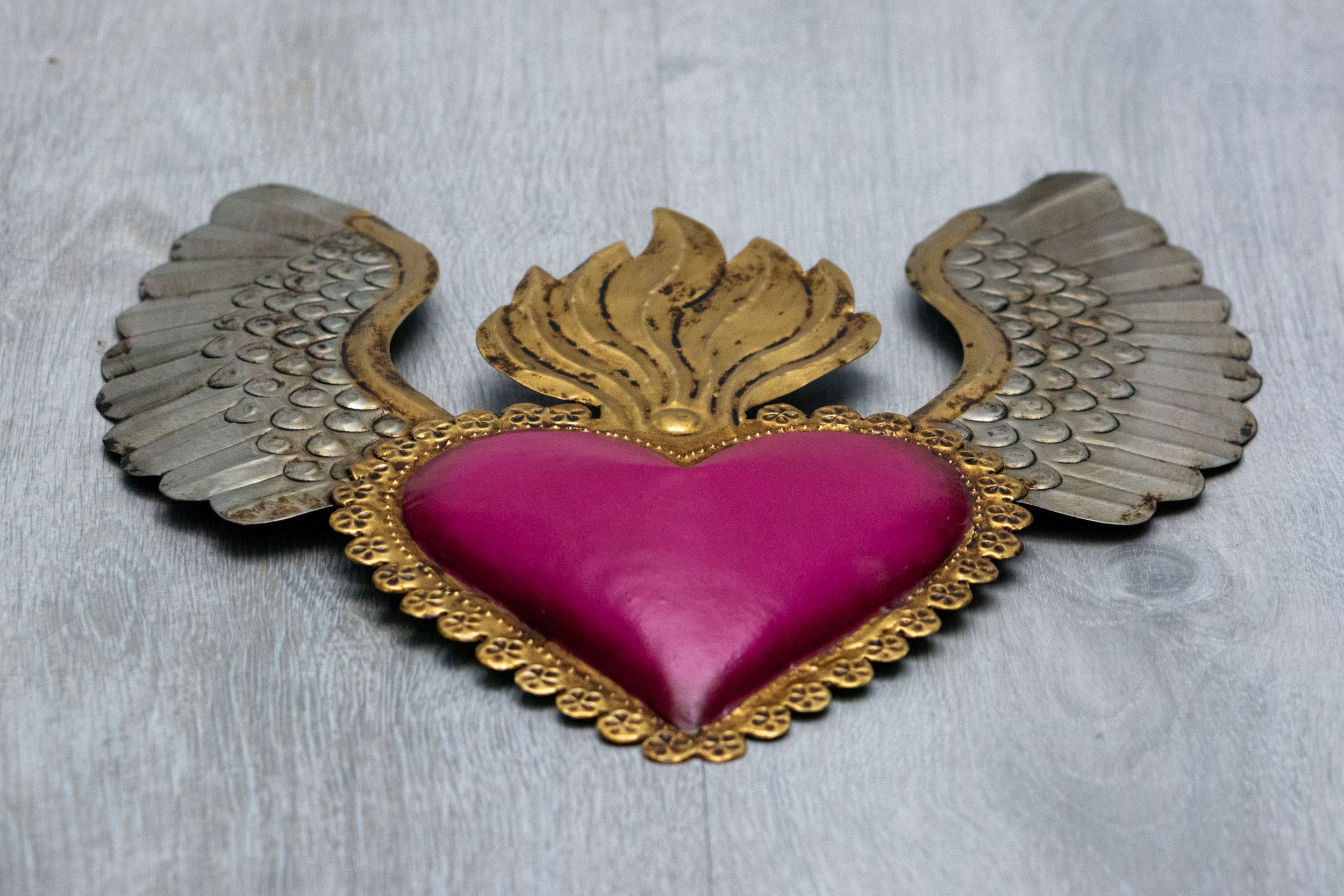Winged heart a flame with flowers