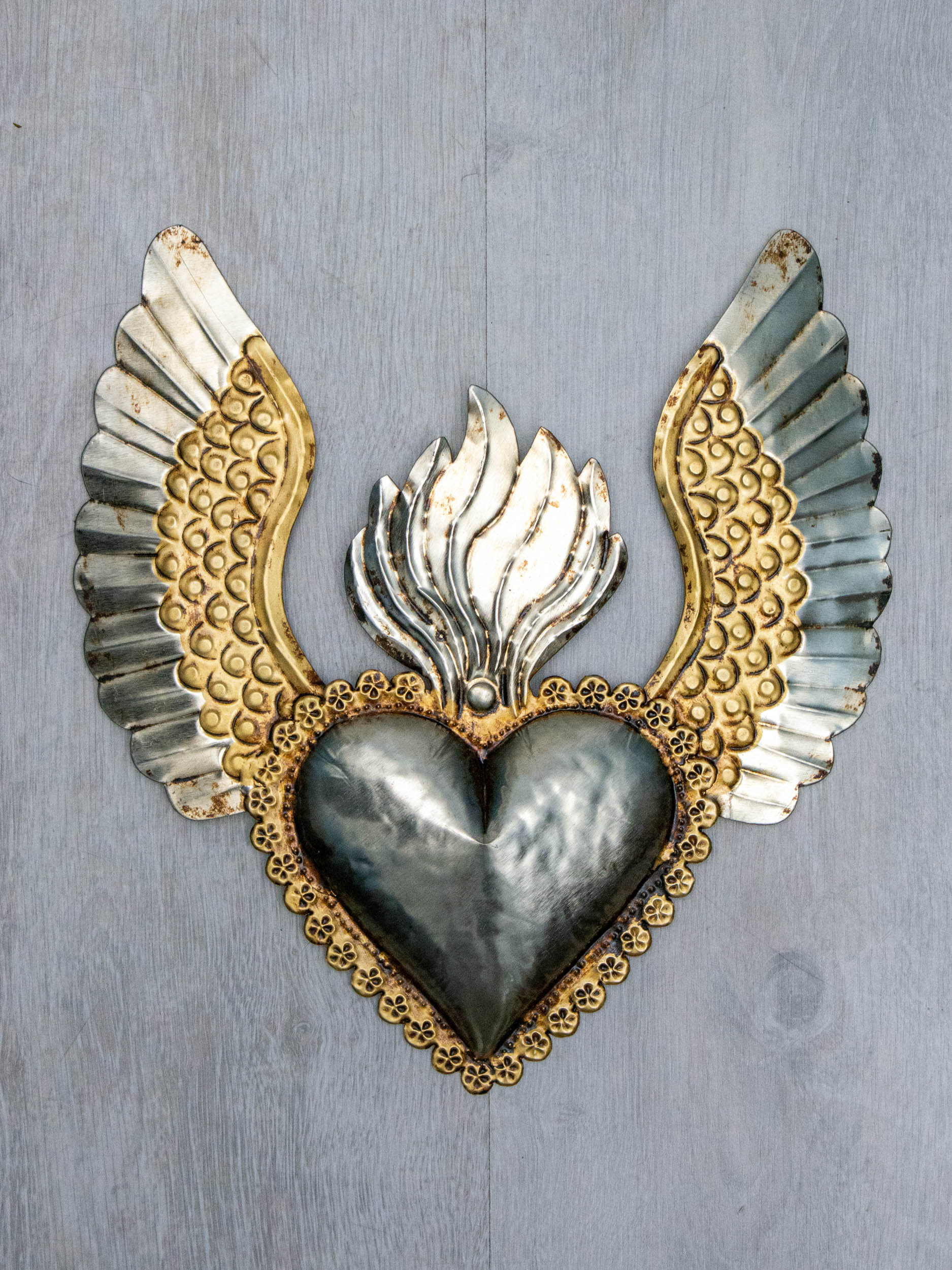 Winged heart a flame with flowers