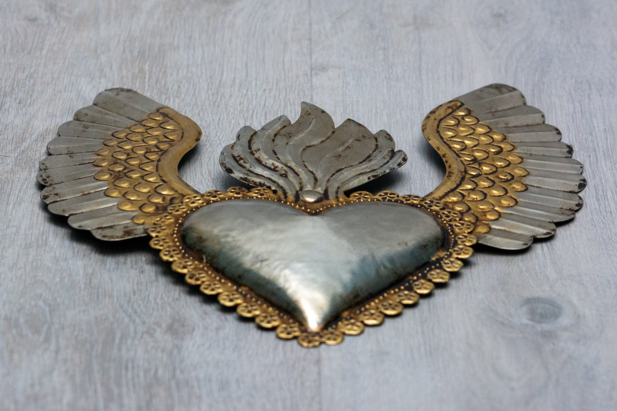 Winged heart a flame with flowers