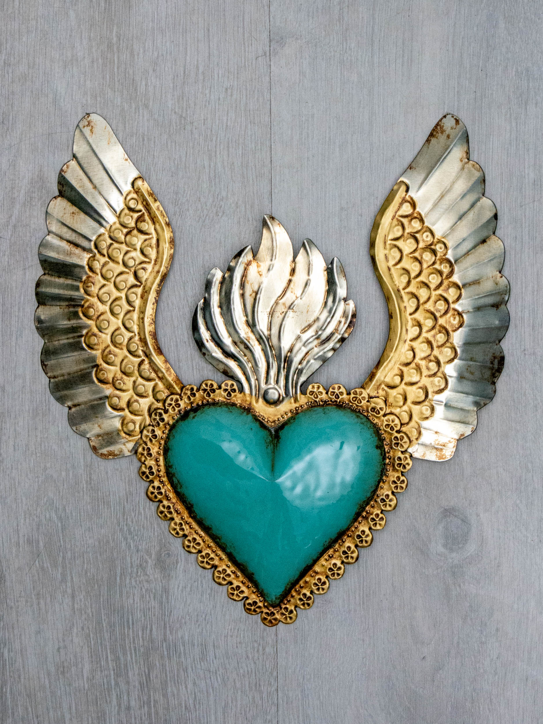 Winged heart a flame with flowers