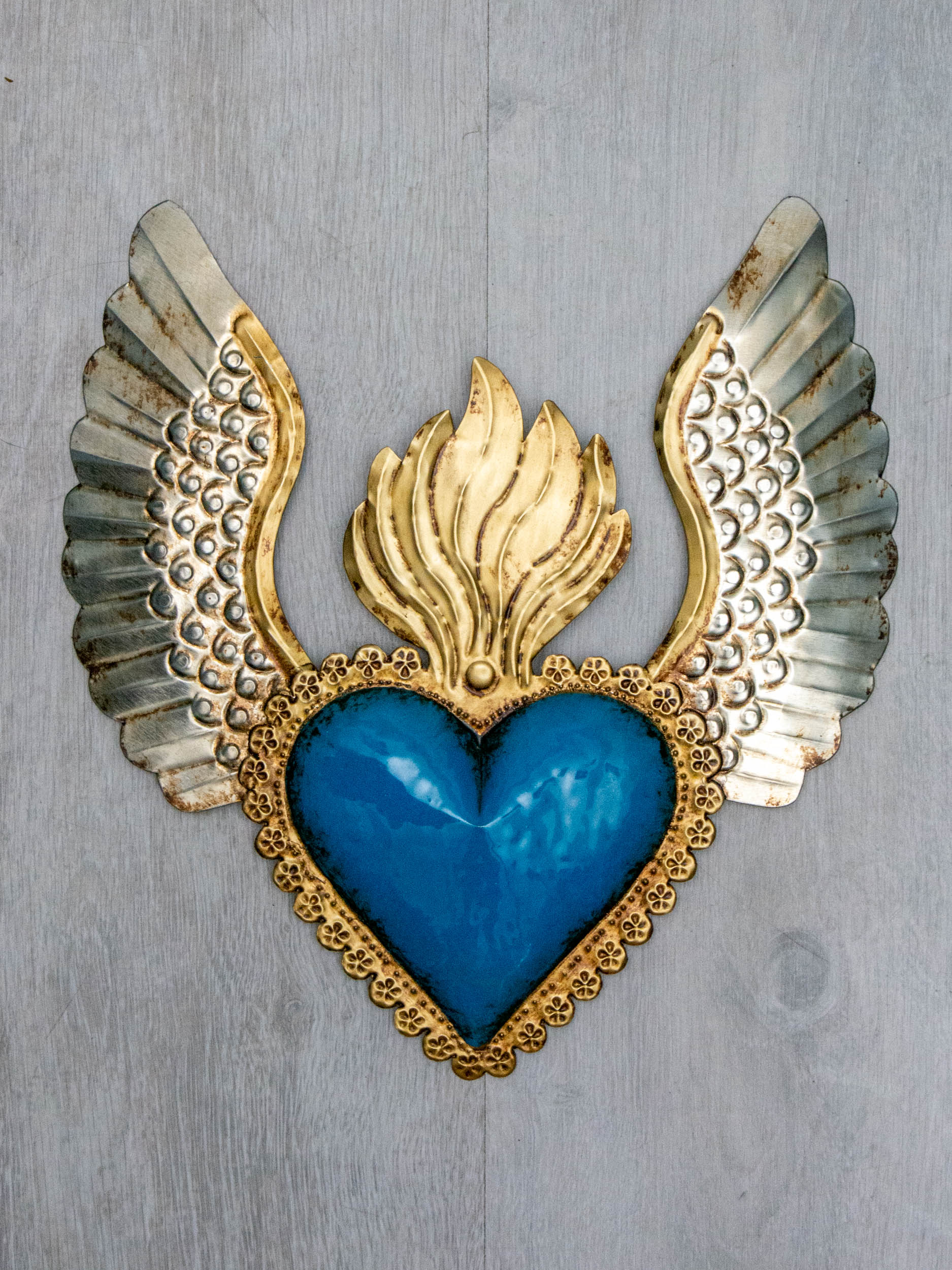 Winged heart a flame with flowers