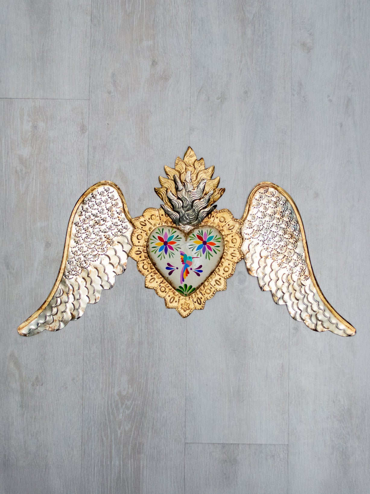 Winged heart facing down double flame Tenango