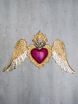 Winged heart below double flame