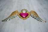 Winged heart below double flame