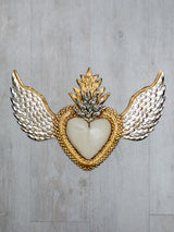 Winged heart above double flame