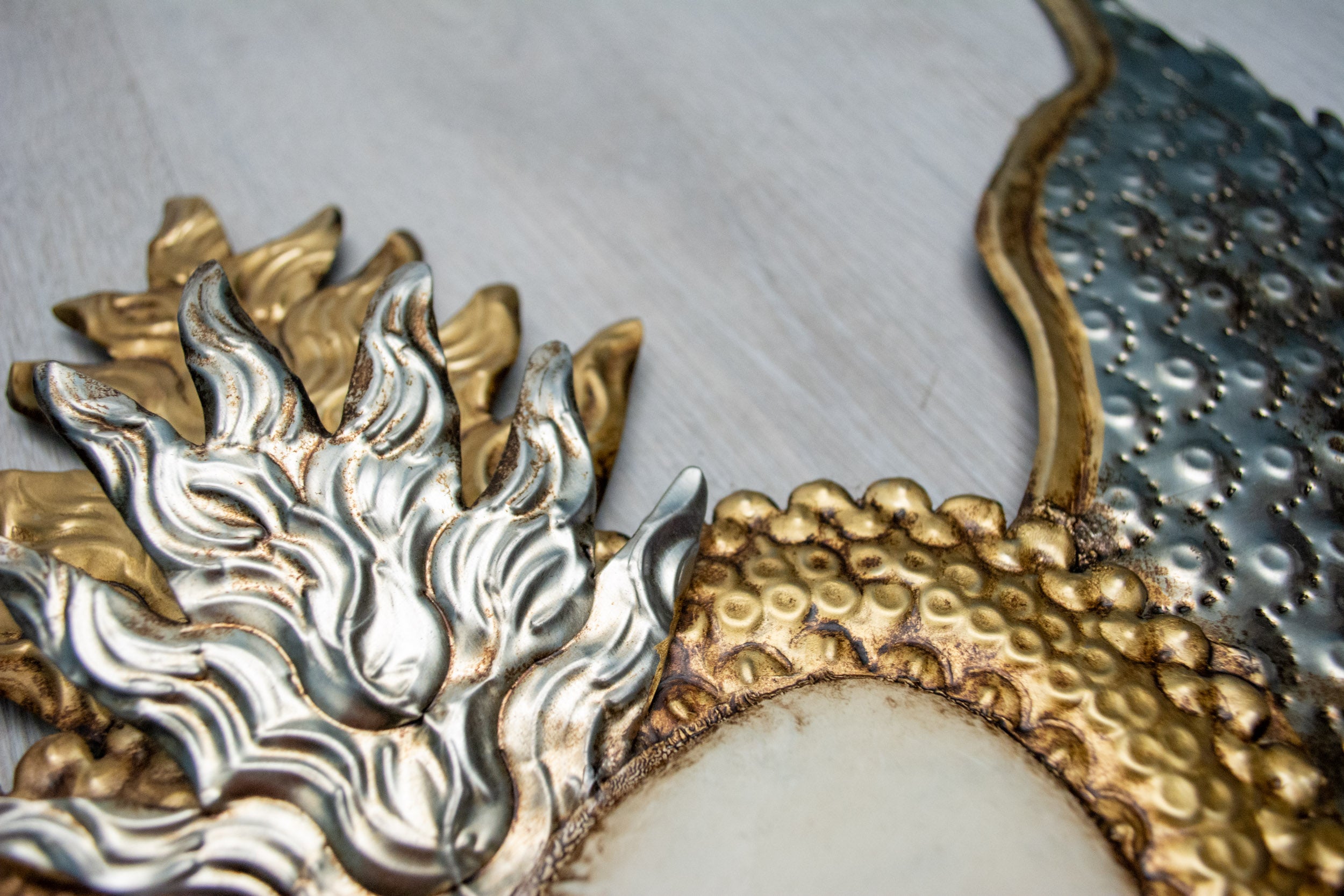 Winged heart above double flame