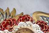 Double flamed winged heart with flowers and candelabra