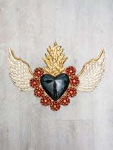 Double flame winged heart above flowers