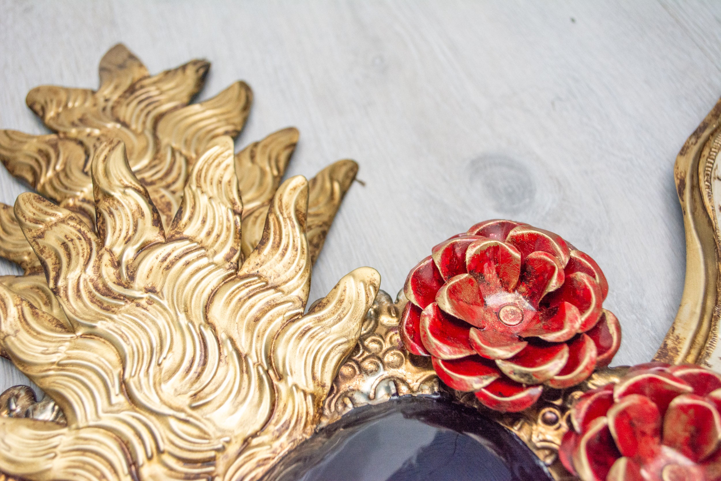 Double flame winged heart above flowers
