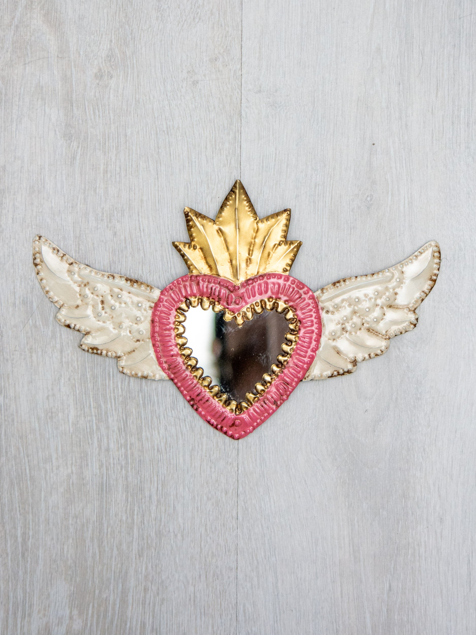 Winged heart with small mirror