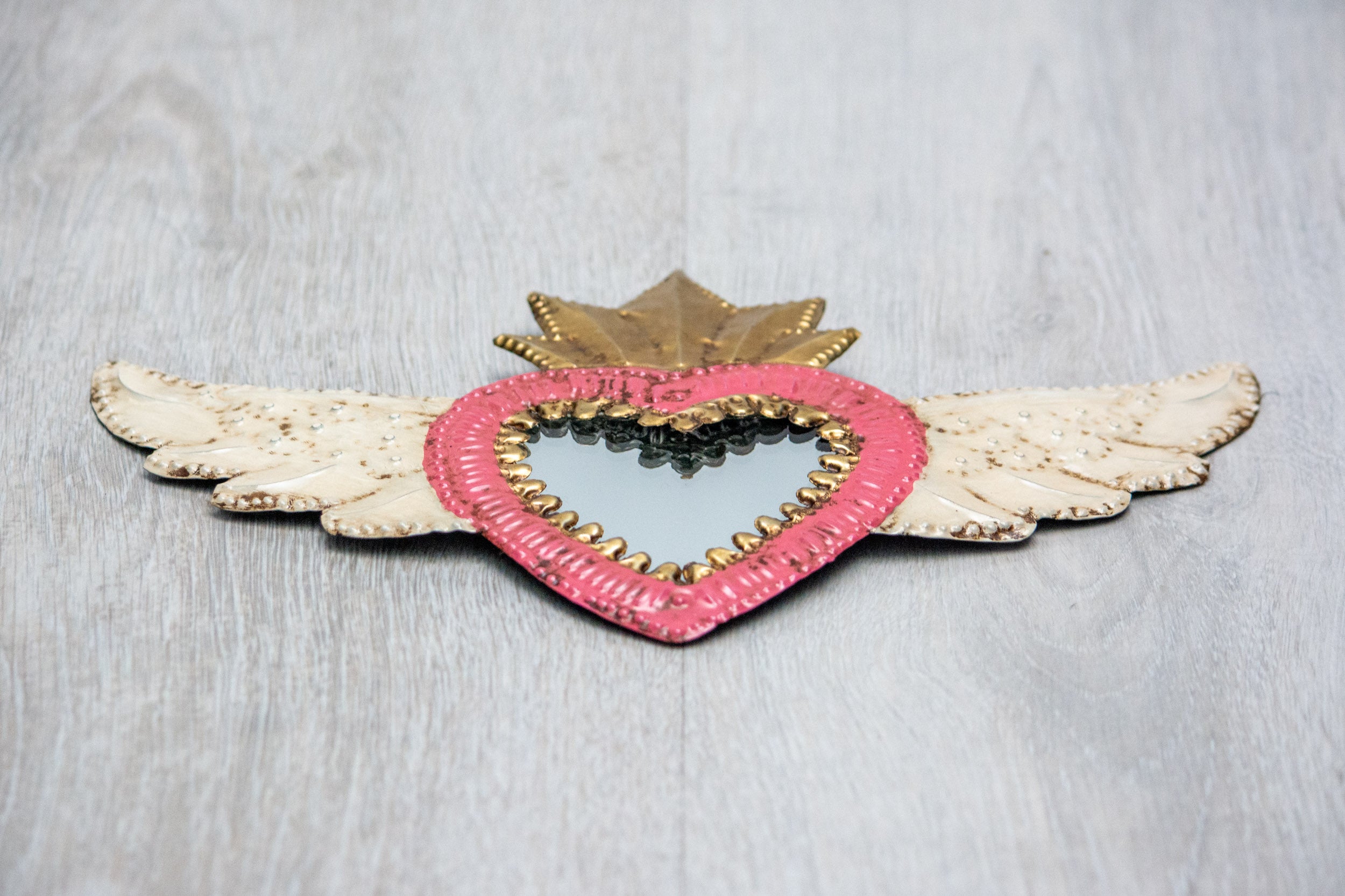 Winged heart with small mirror