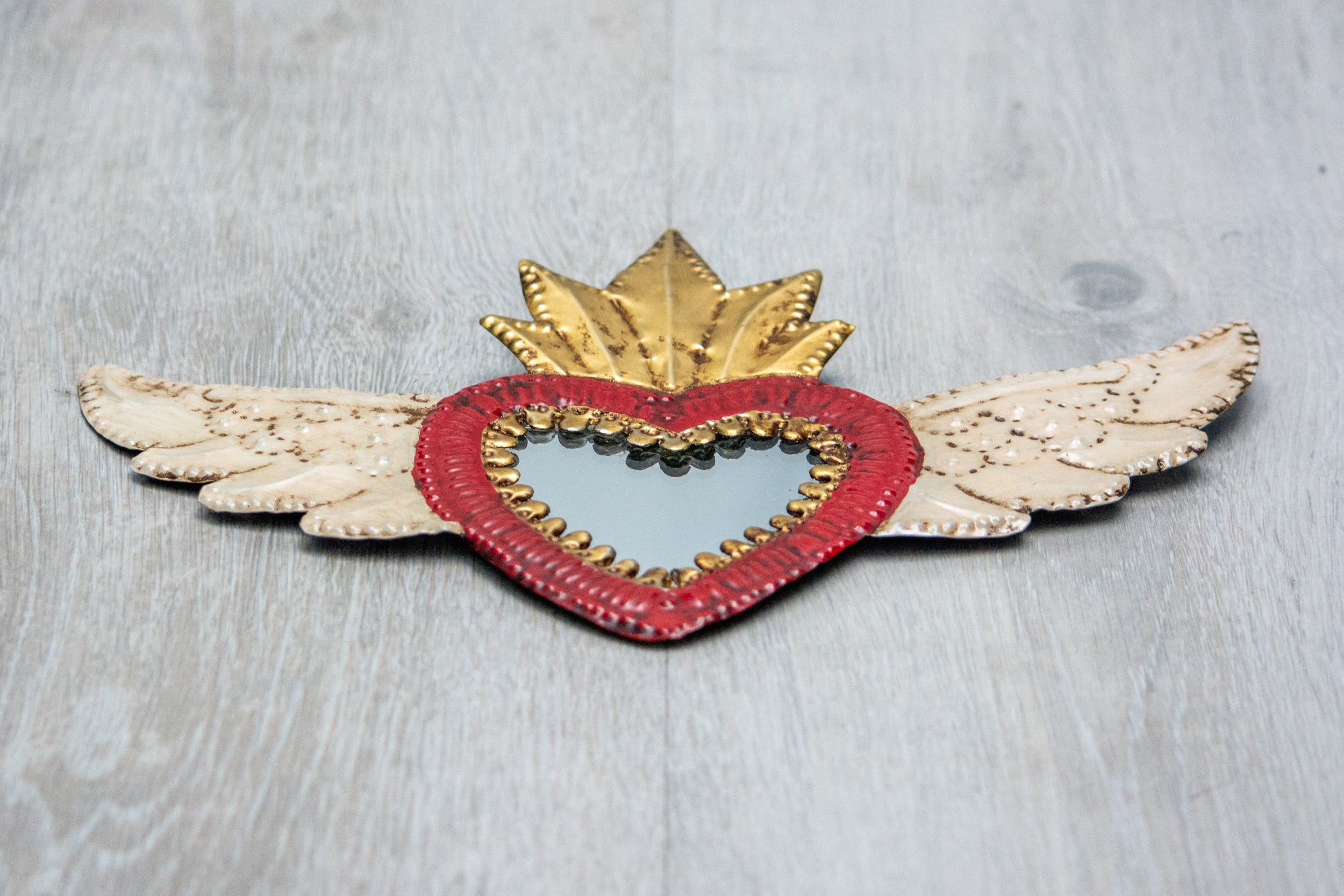 Winged heart with small mirror