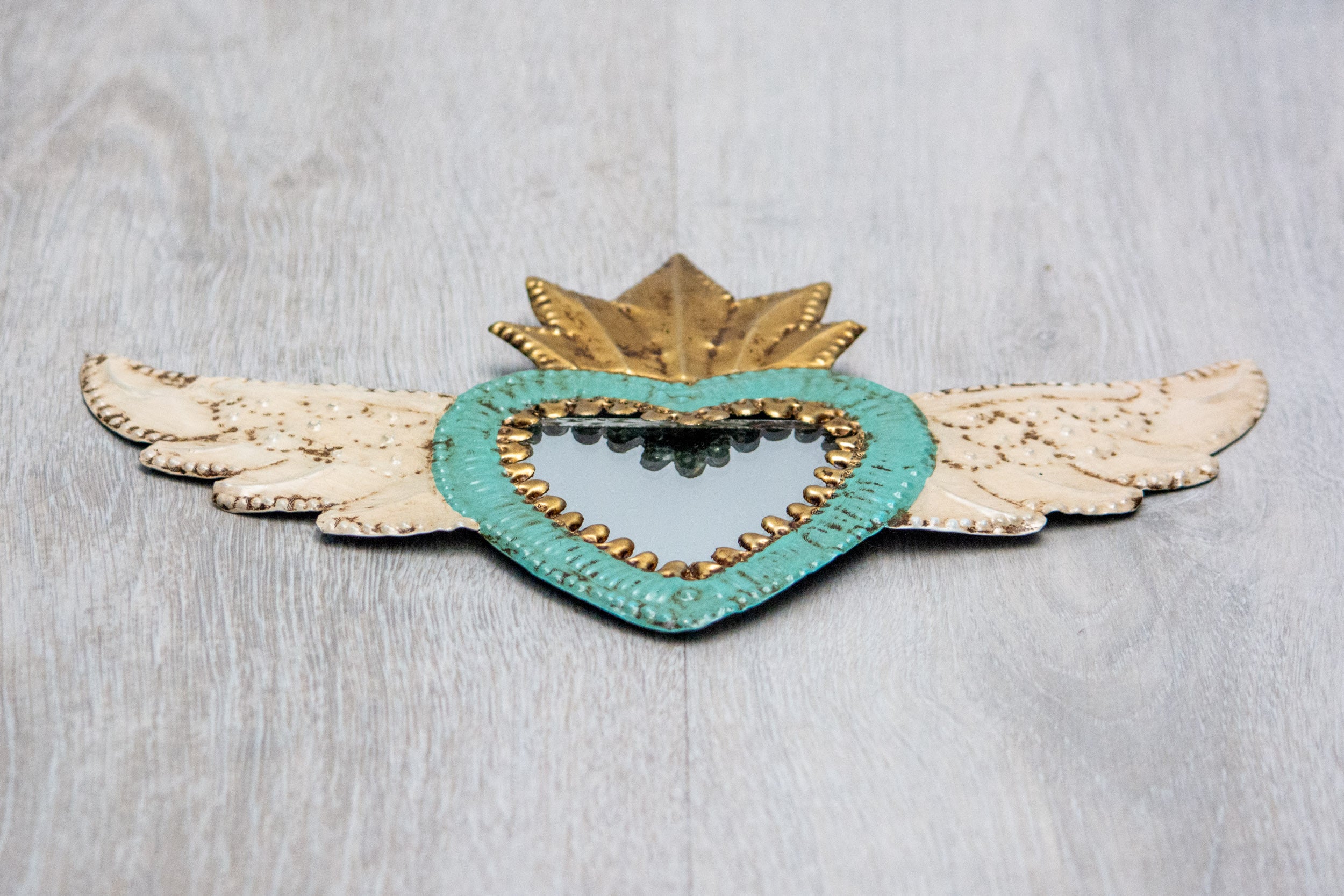 Winged heart with small mirror