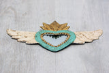 Winged heart with small mirror