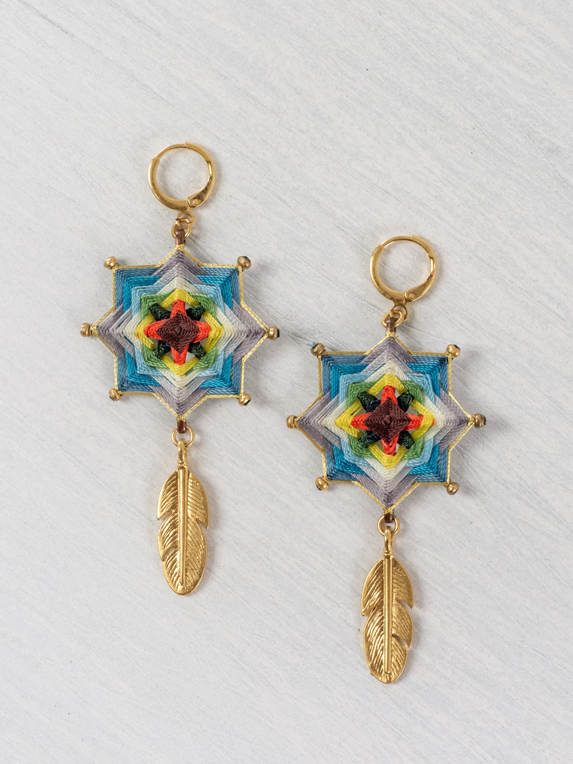 Small star mandala earrings with feathers