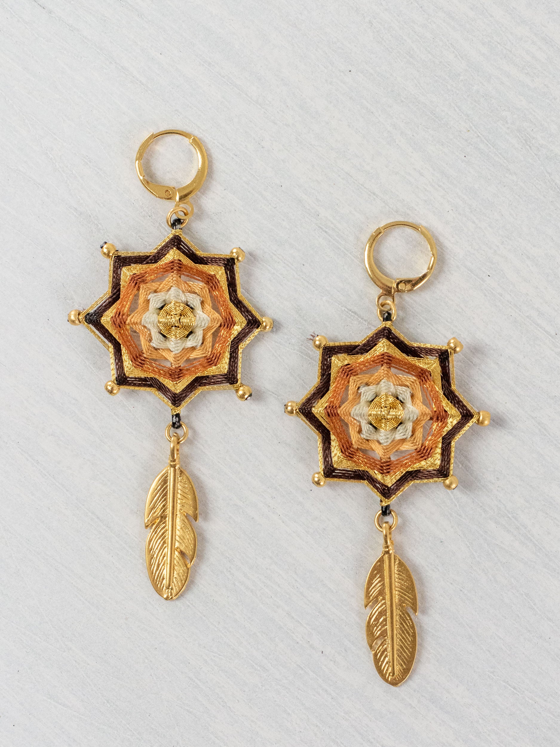 Small star mandala earrings with feathers
