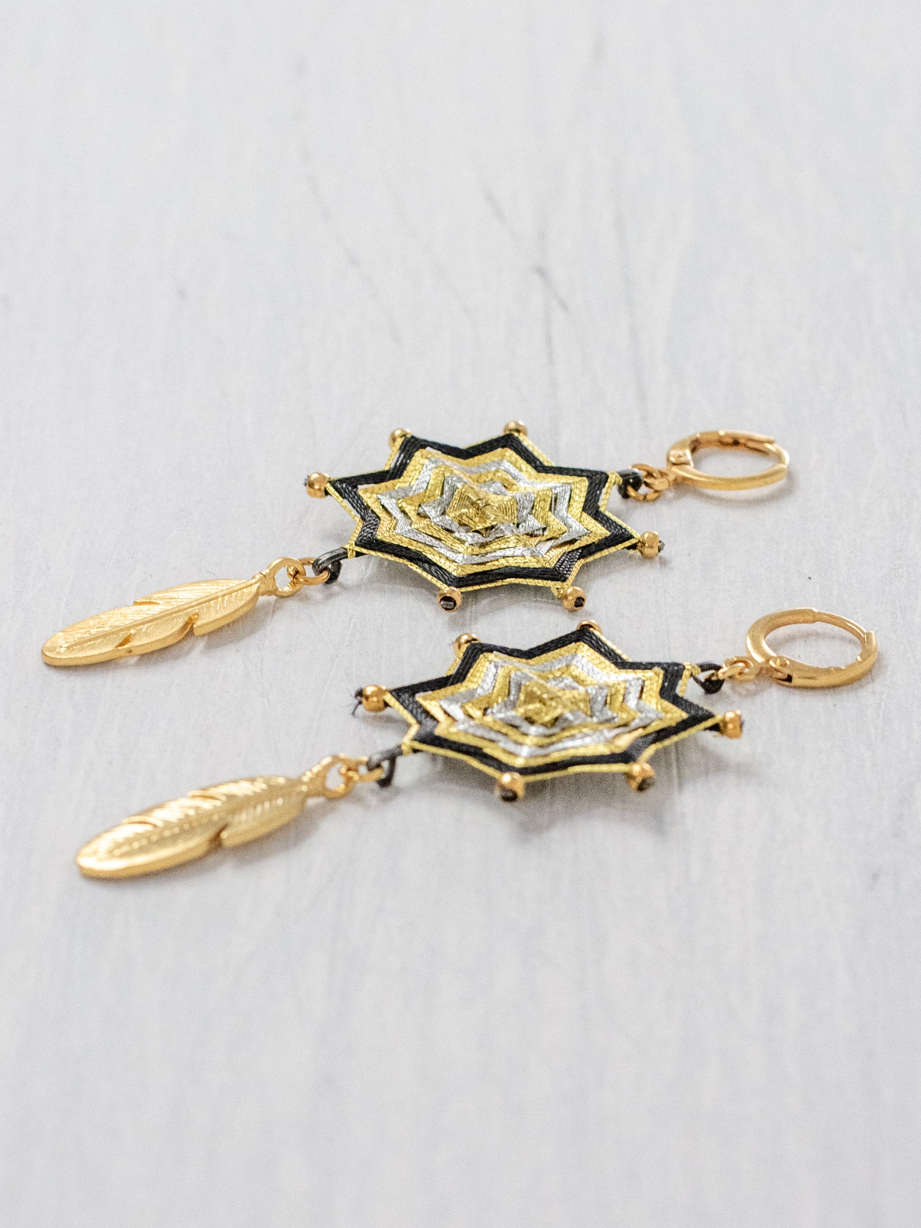Small star mandala earrings with feathers