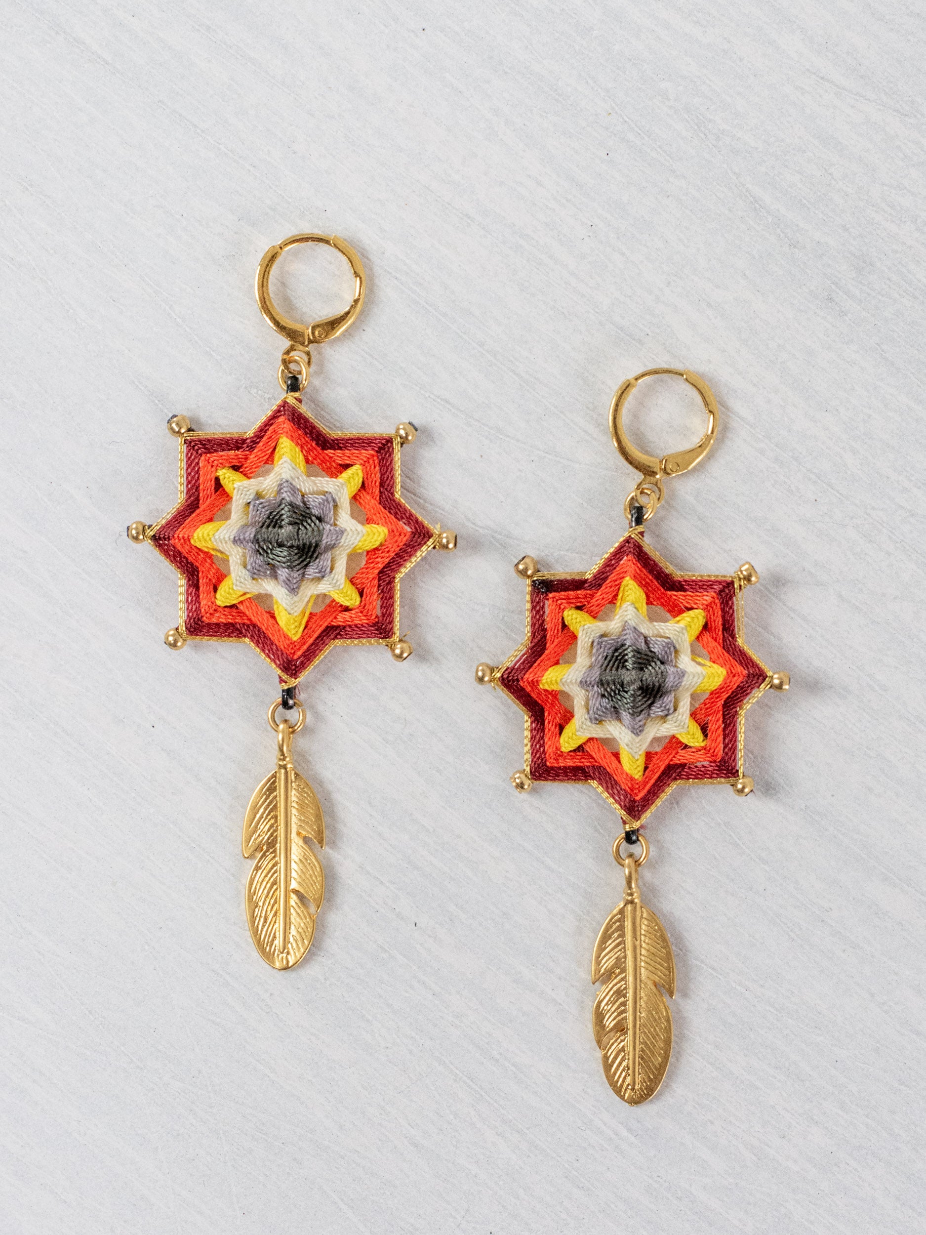 Small star mandala earrings with feathers