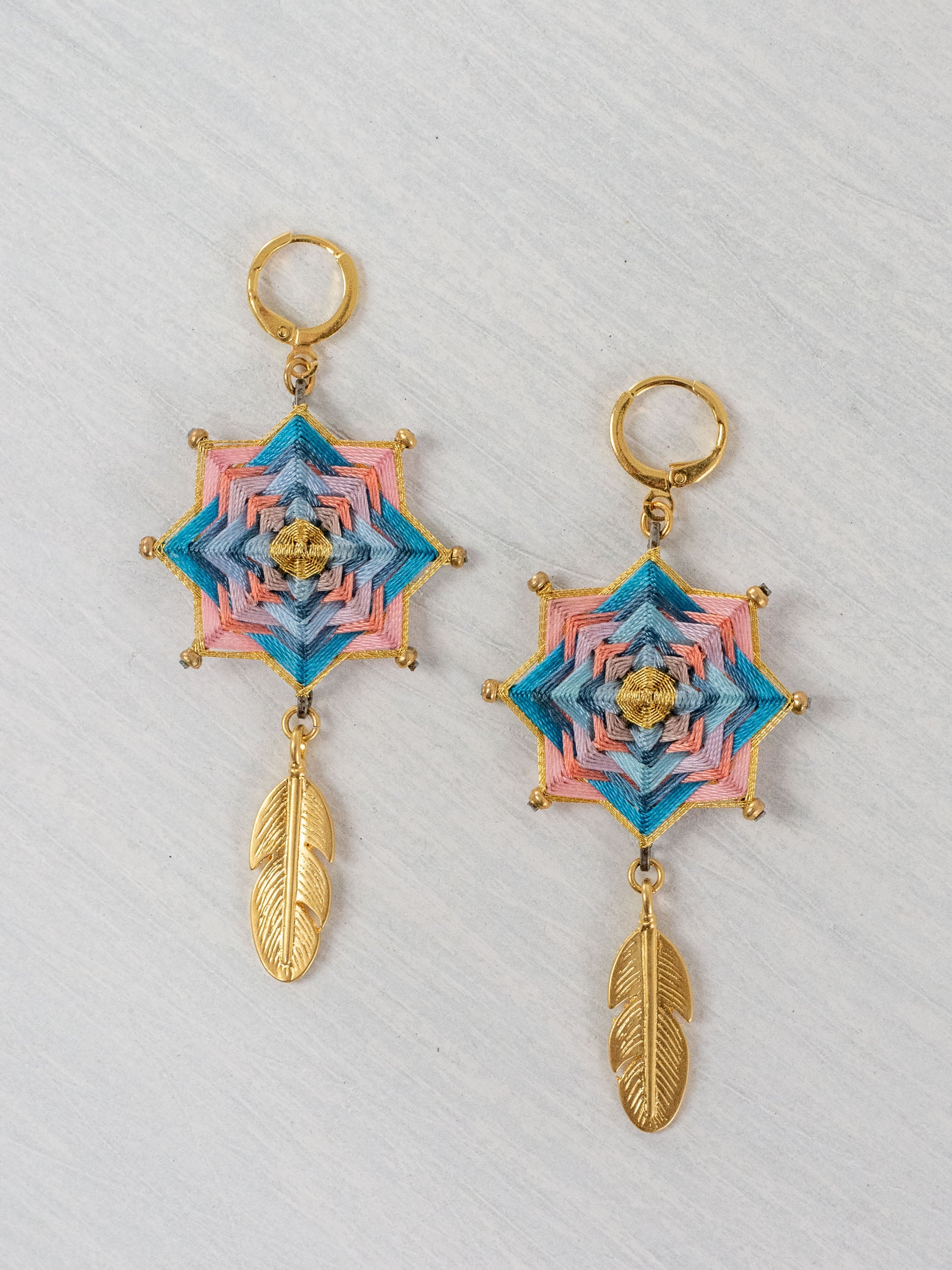 Small star mandala earrings with feathers