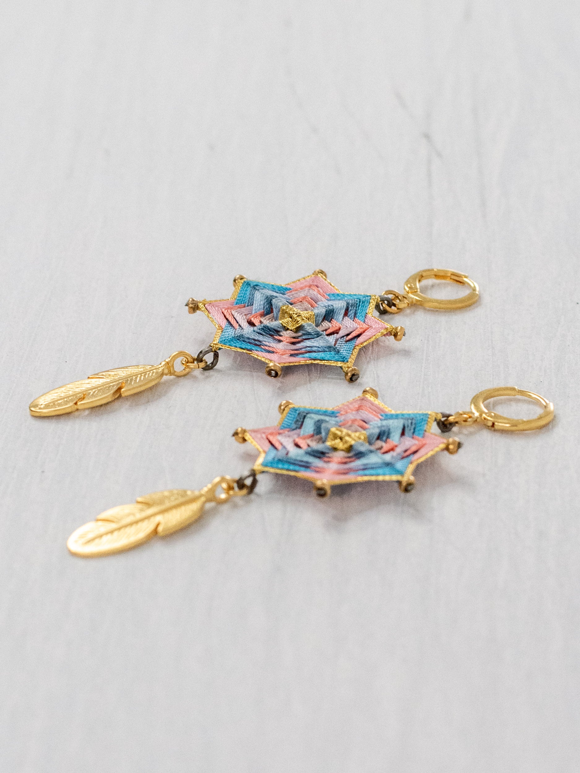 Small star mandala earrings with feathers