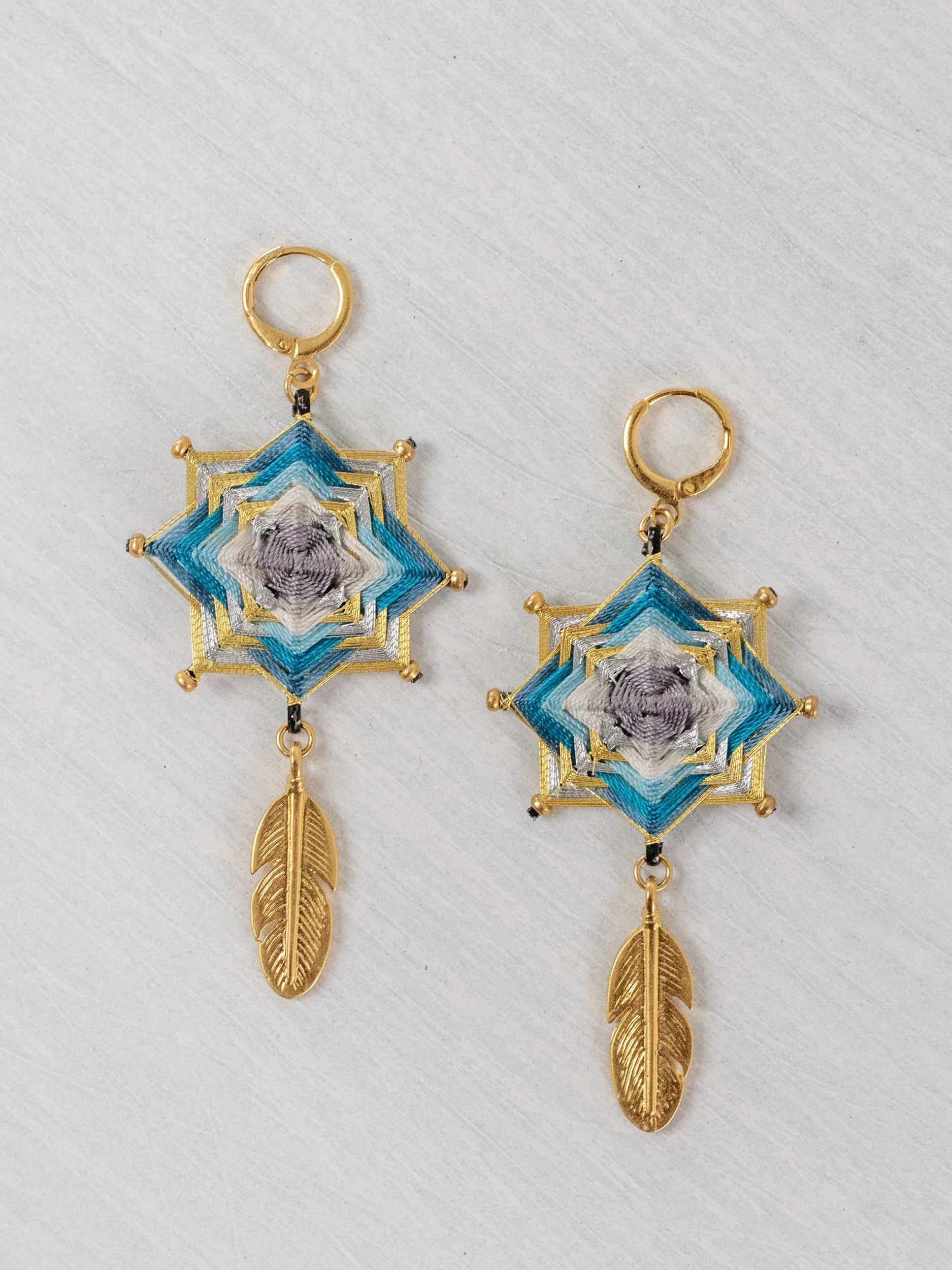 Small star mandala earrings with feathers