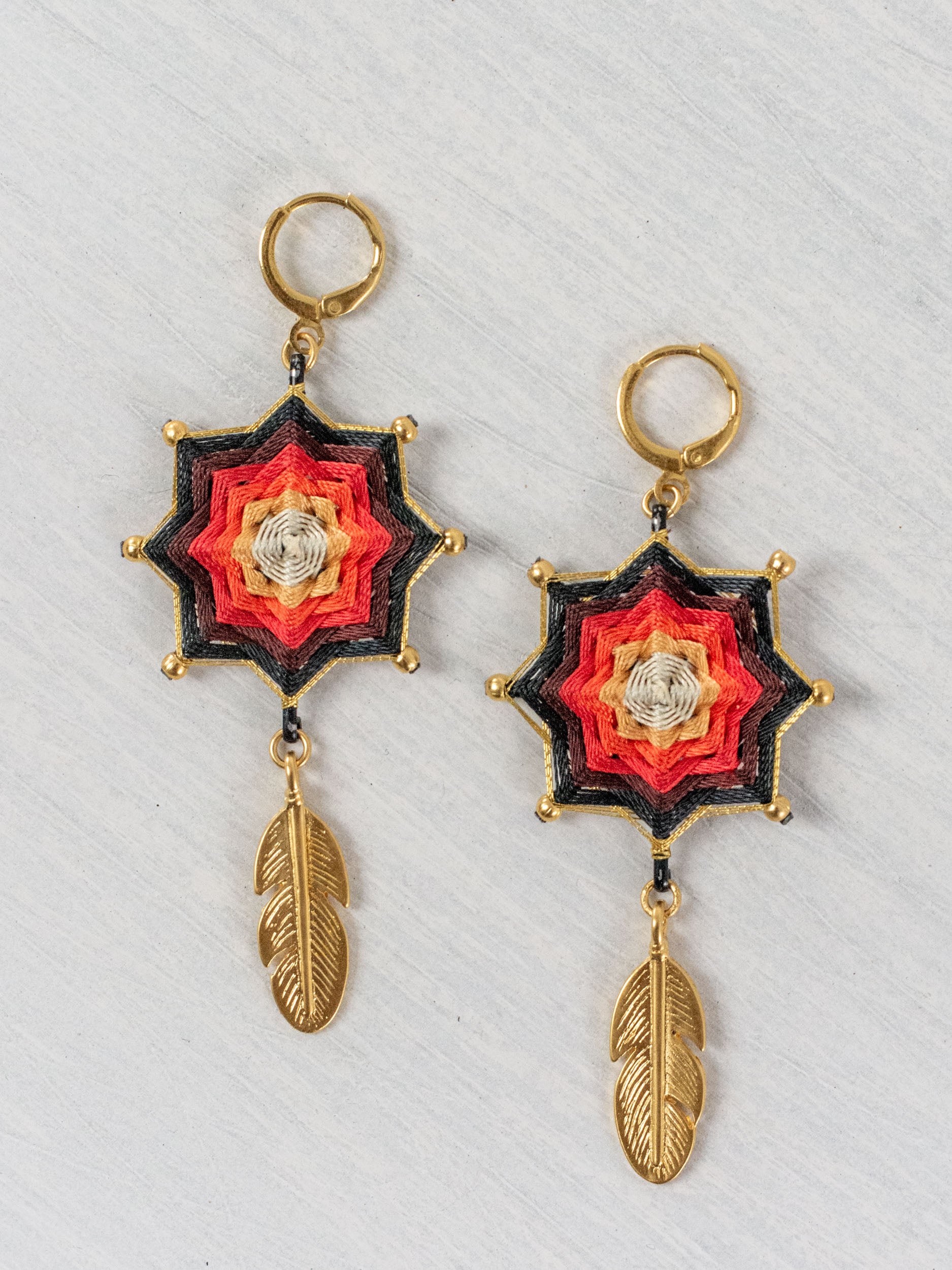 Small star mandala earrings with feathers