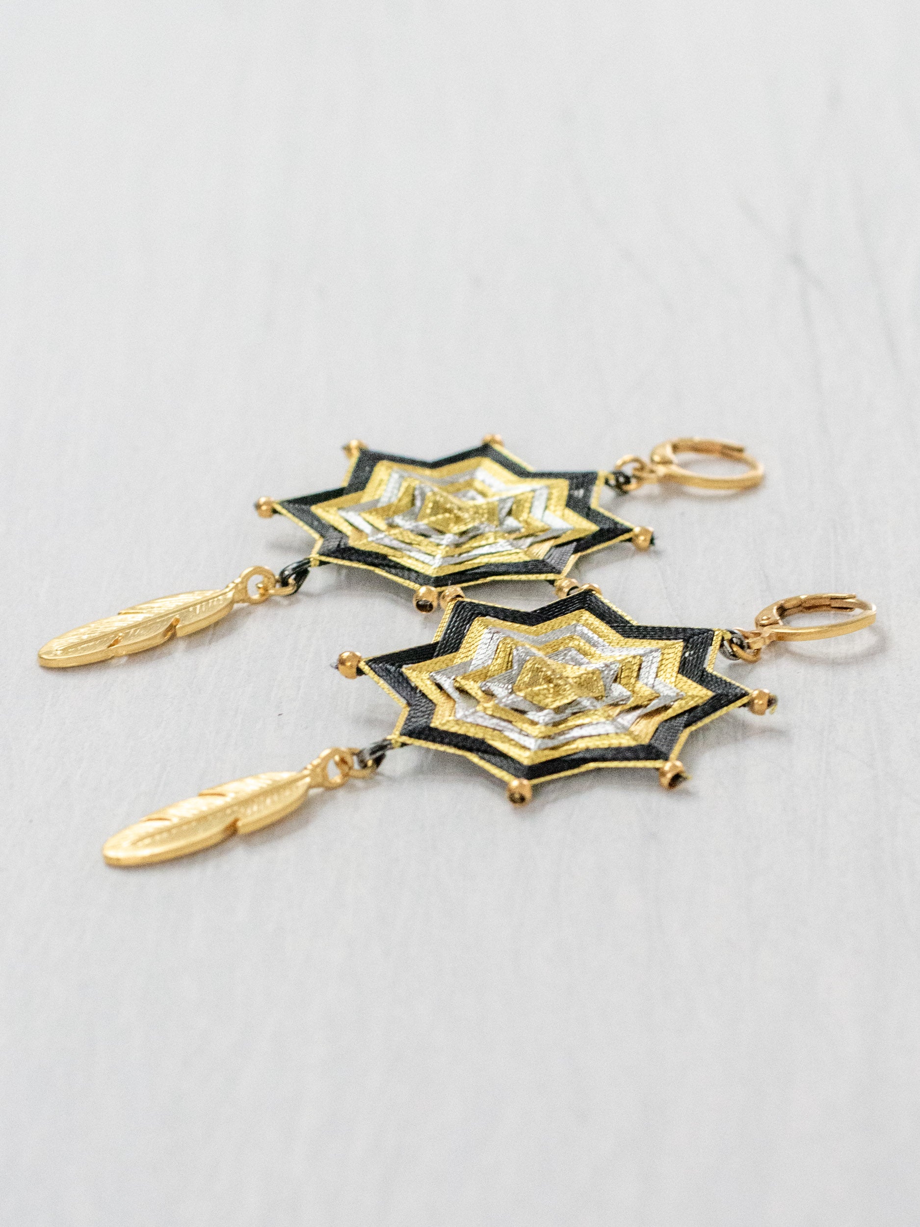 Mandala star earrings with large feathers