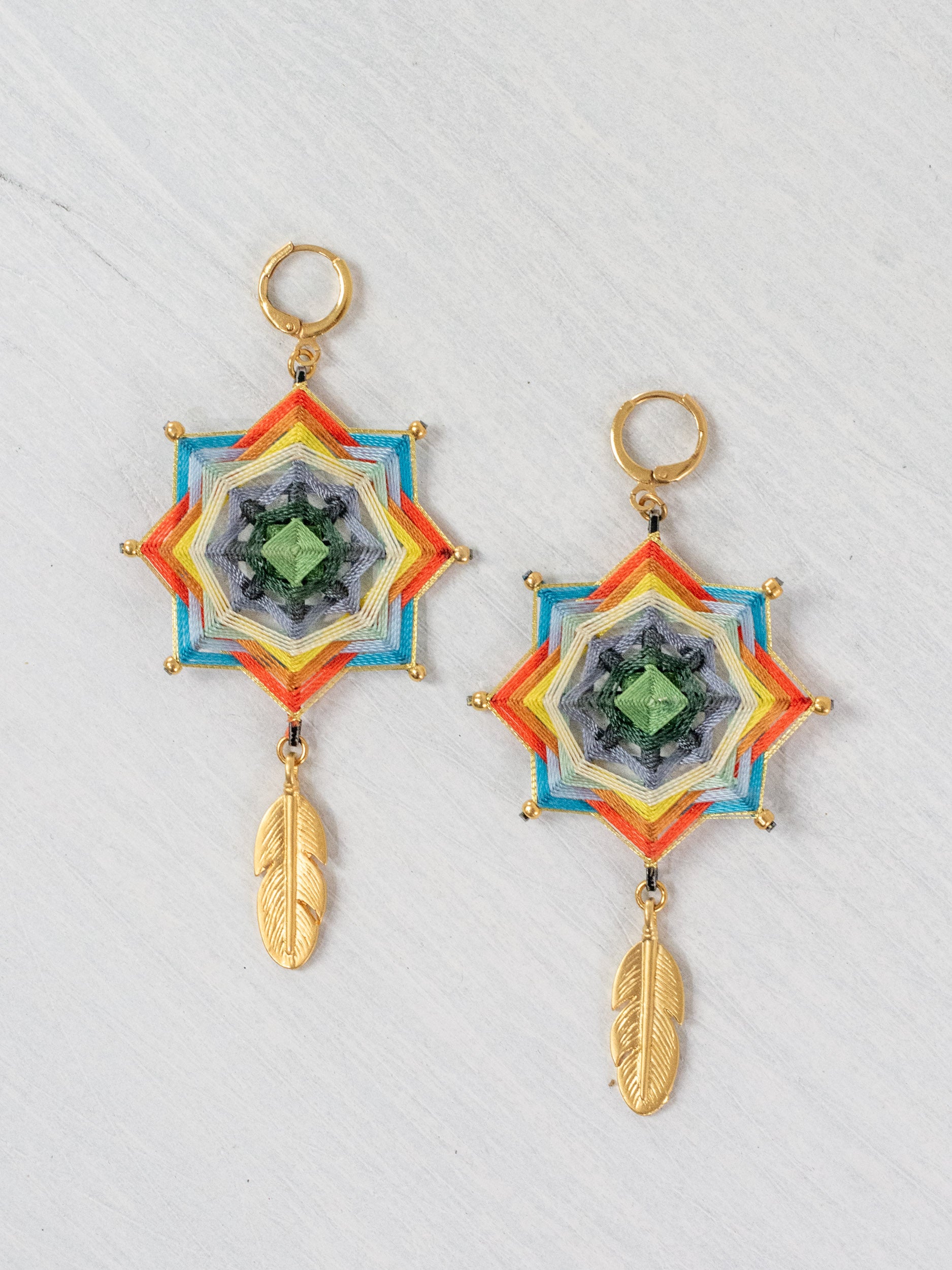 Mandala star earrings with large feathers