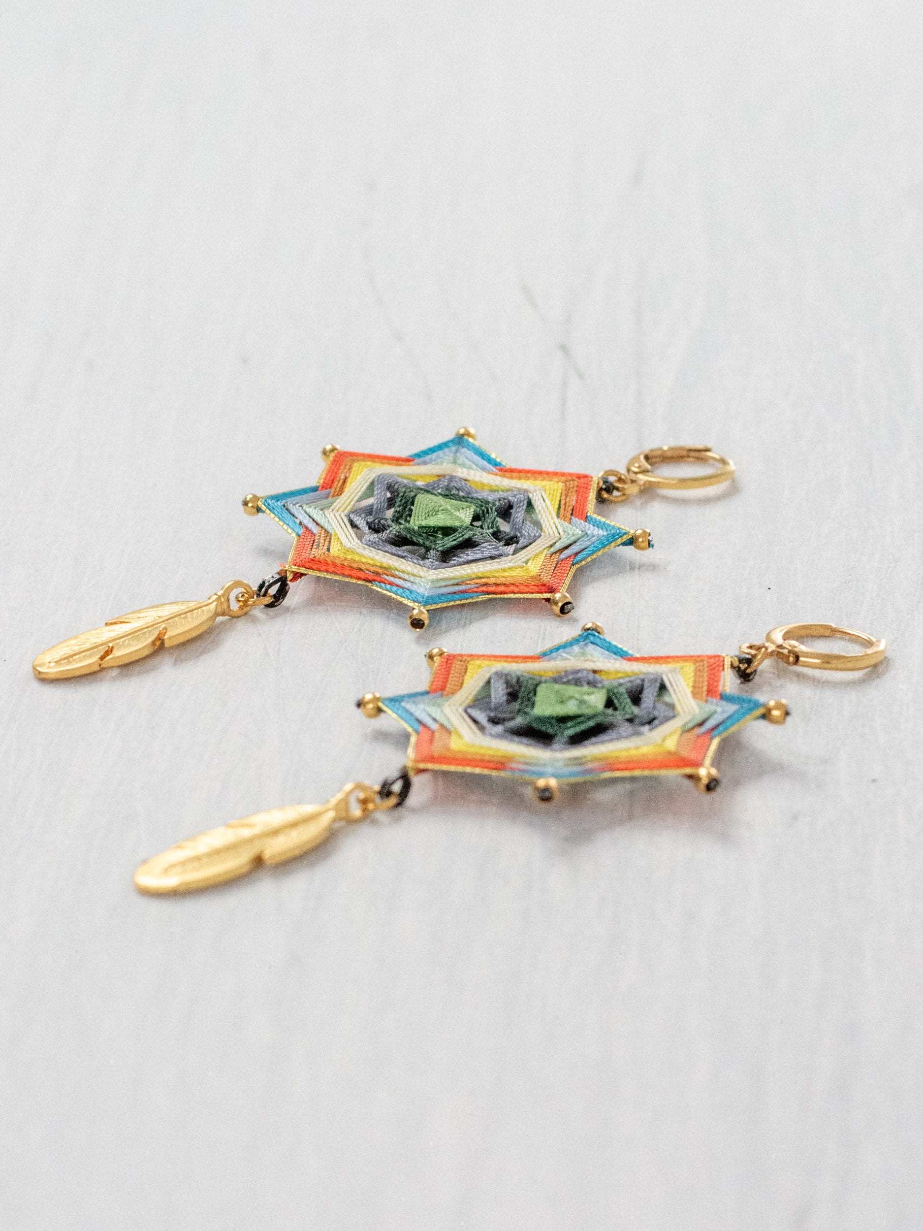 Mandala star earrings with large feathers