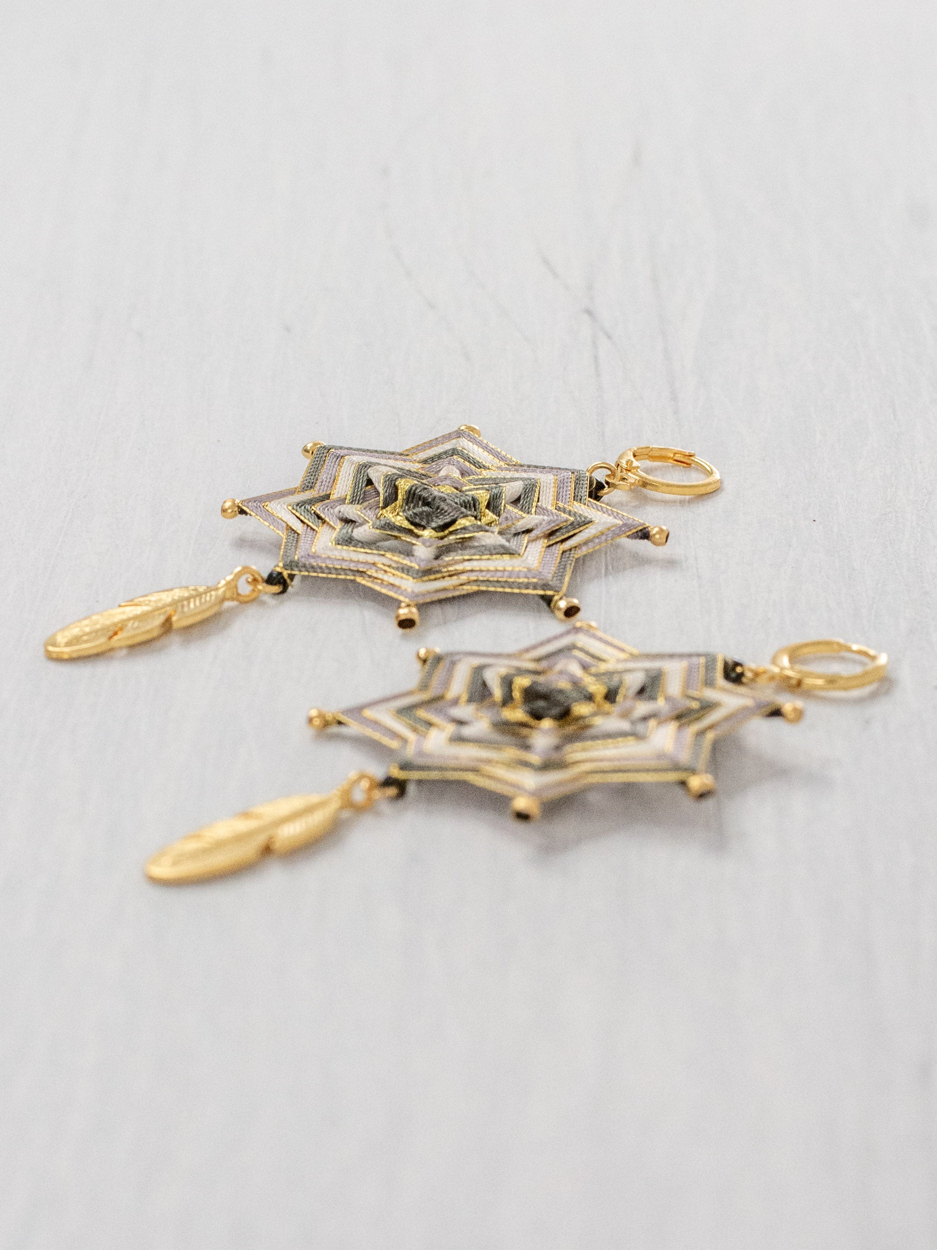 Mandala star earrings with large feathers