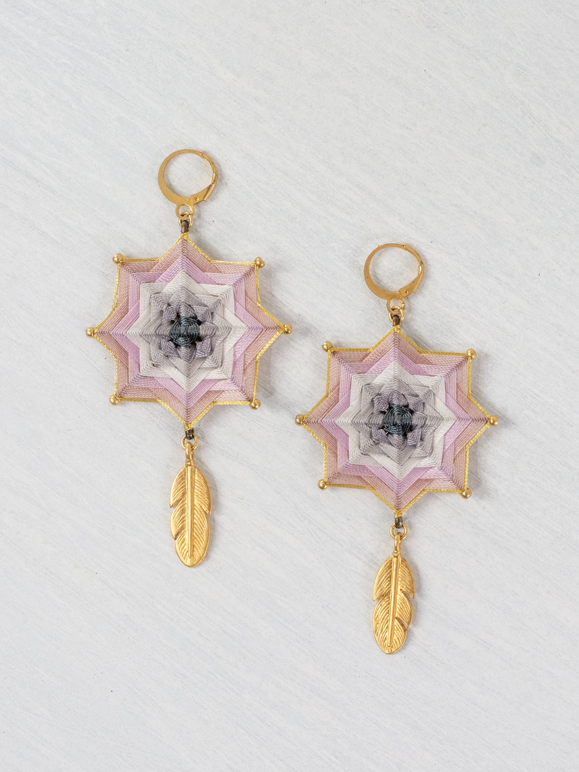Mandala star earrings with large feathers