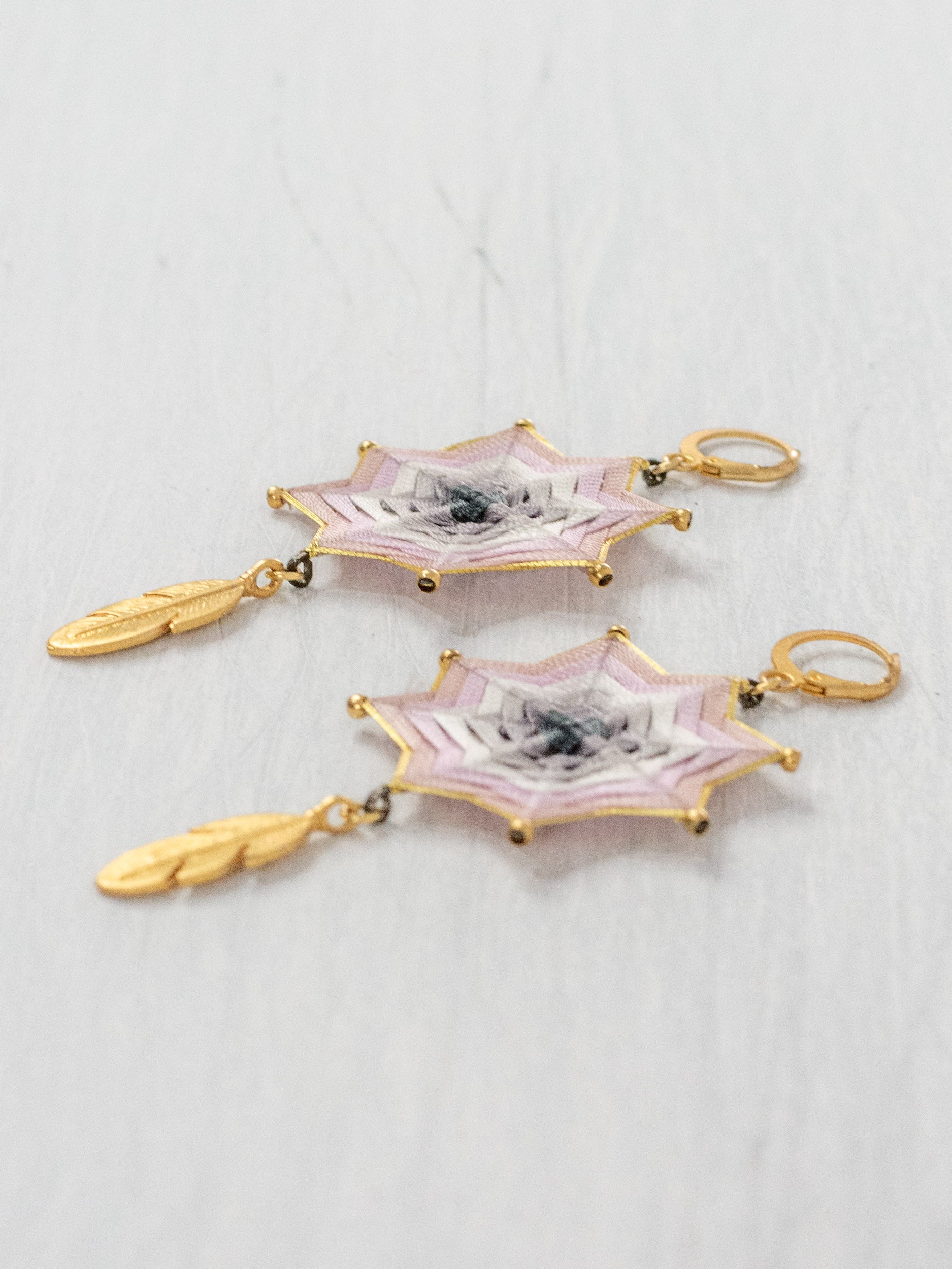 Mandala star earrings with large feathers