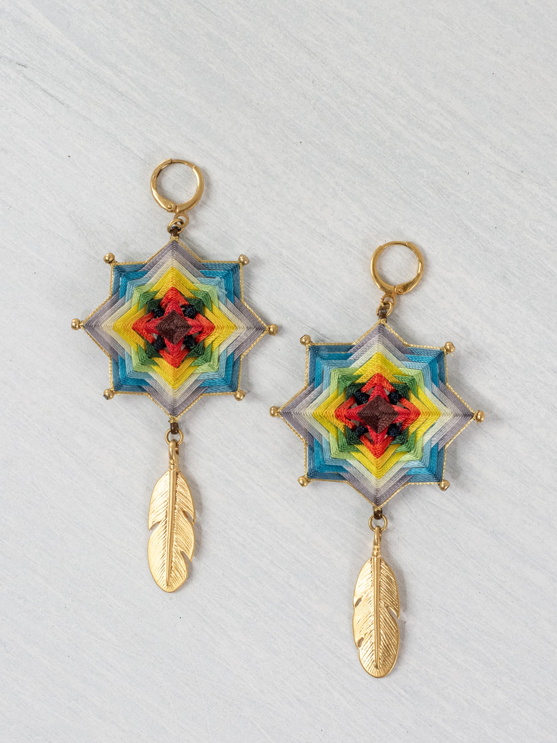 Mandala star earrings with large feathers