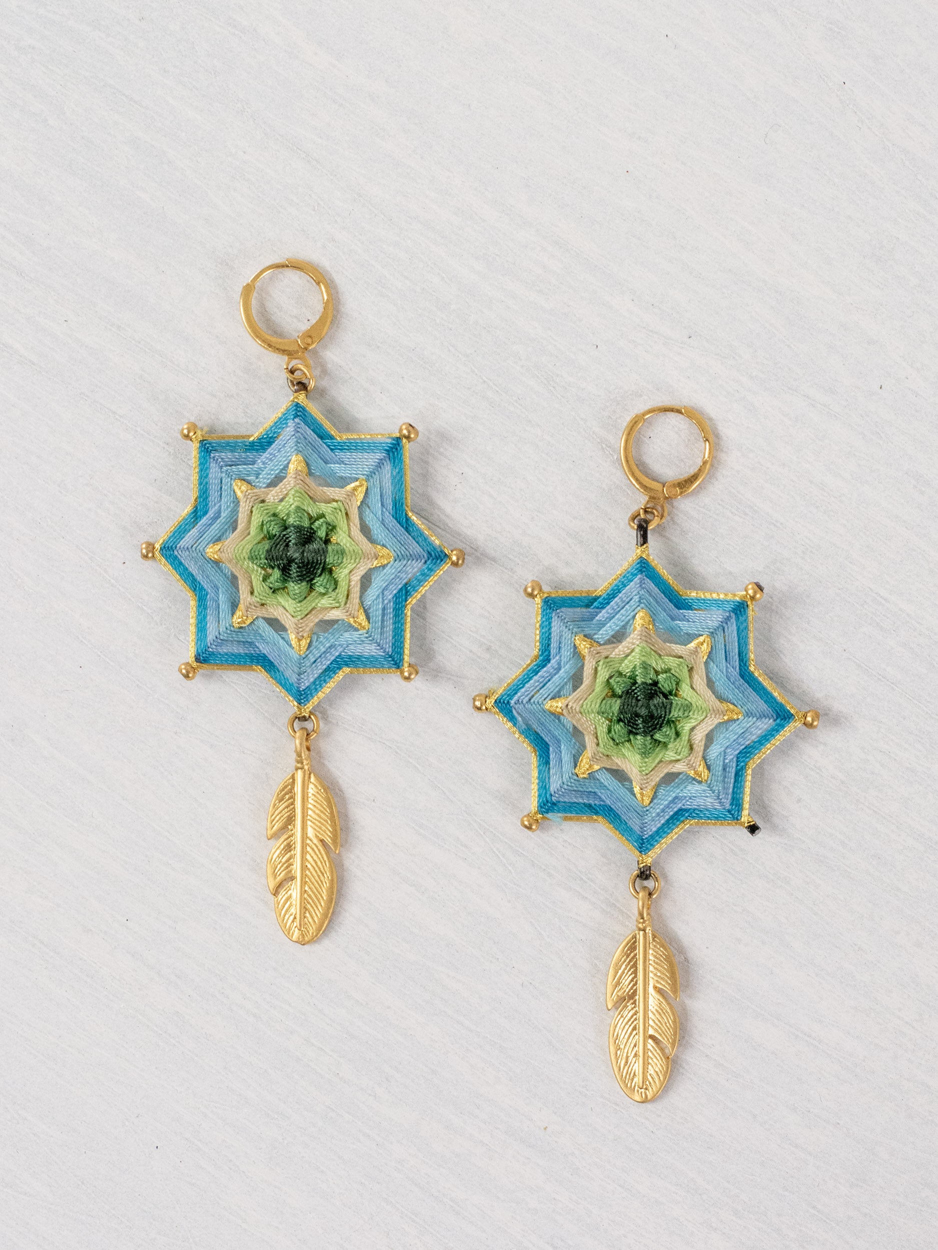 Mandala star earrings with large feathers