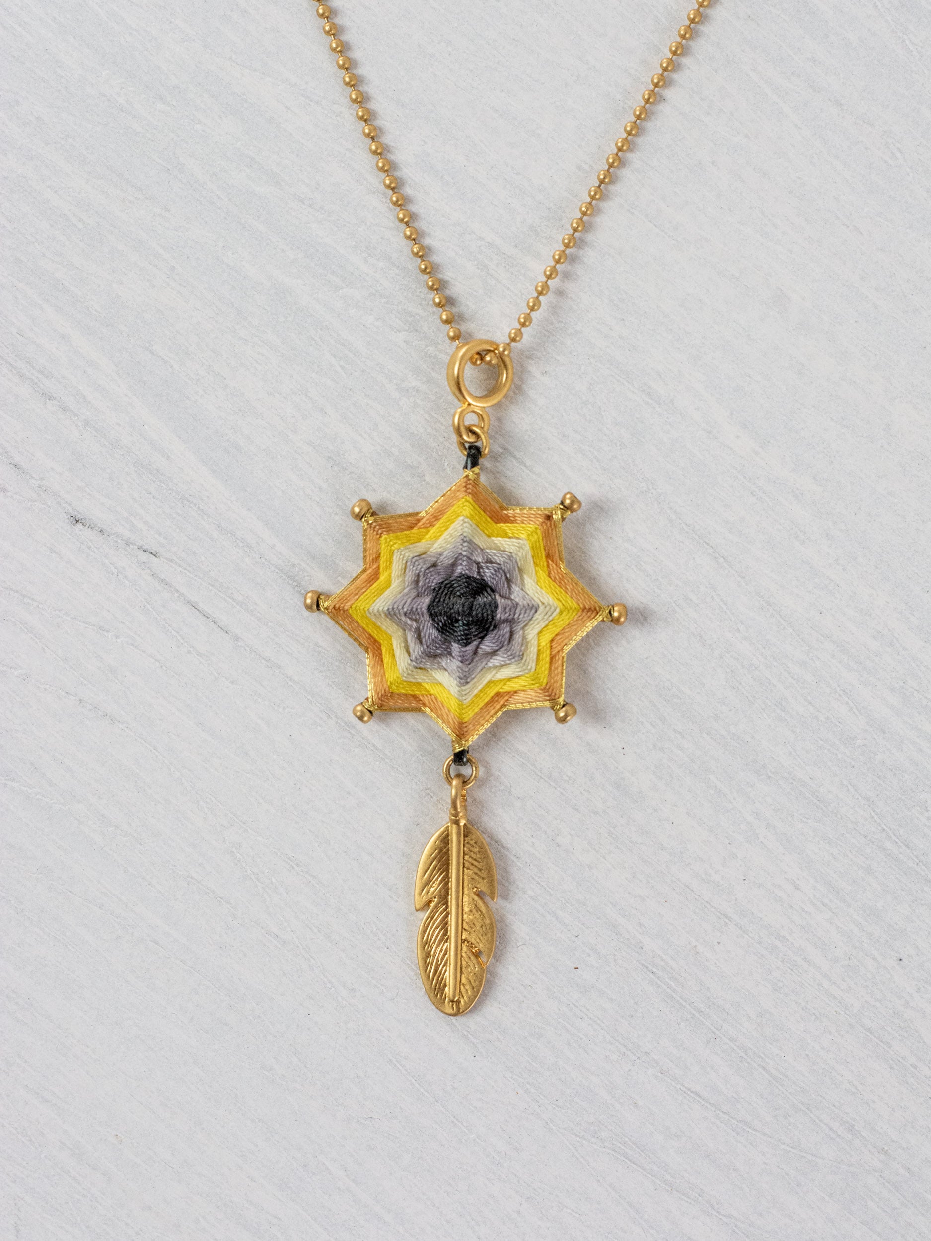 Small mandala star necklace with feather