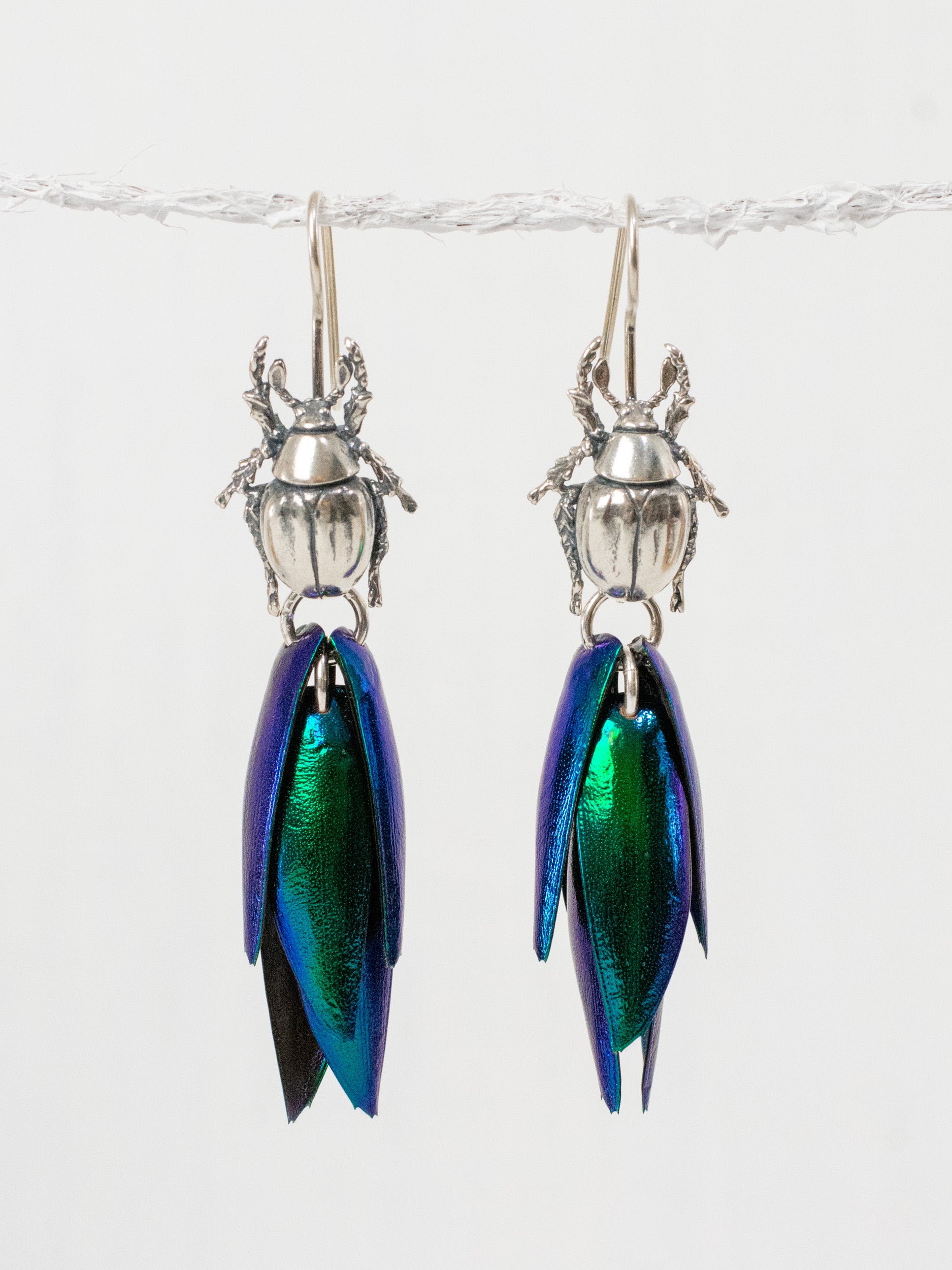 Iridescent beetle drop earrings