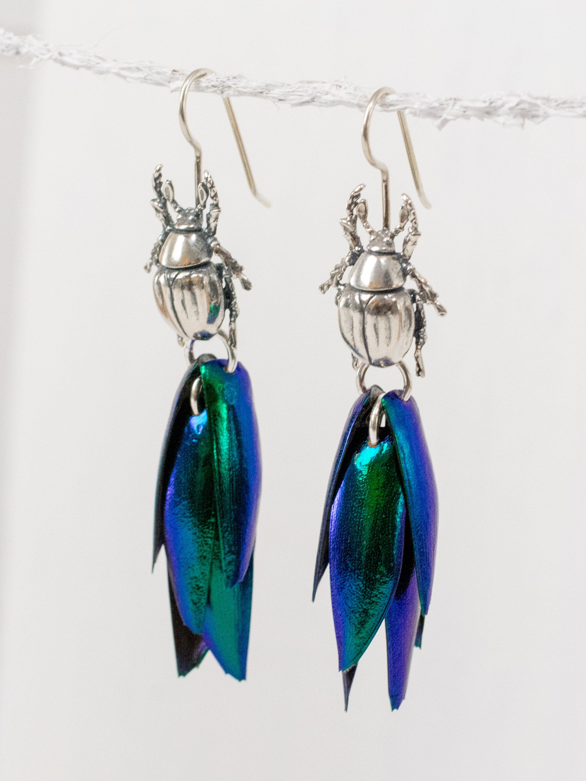 Iridescent beetle drop earrings