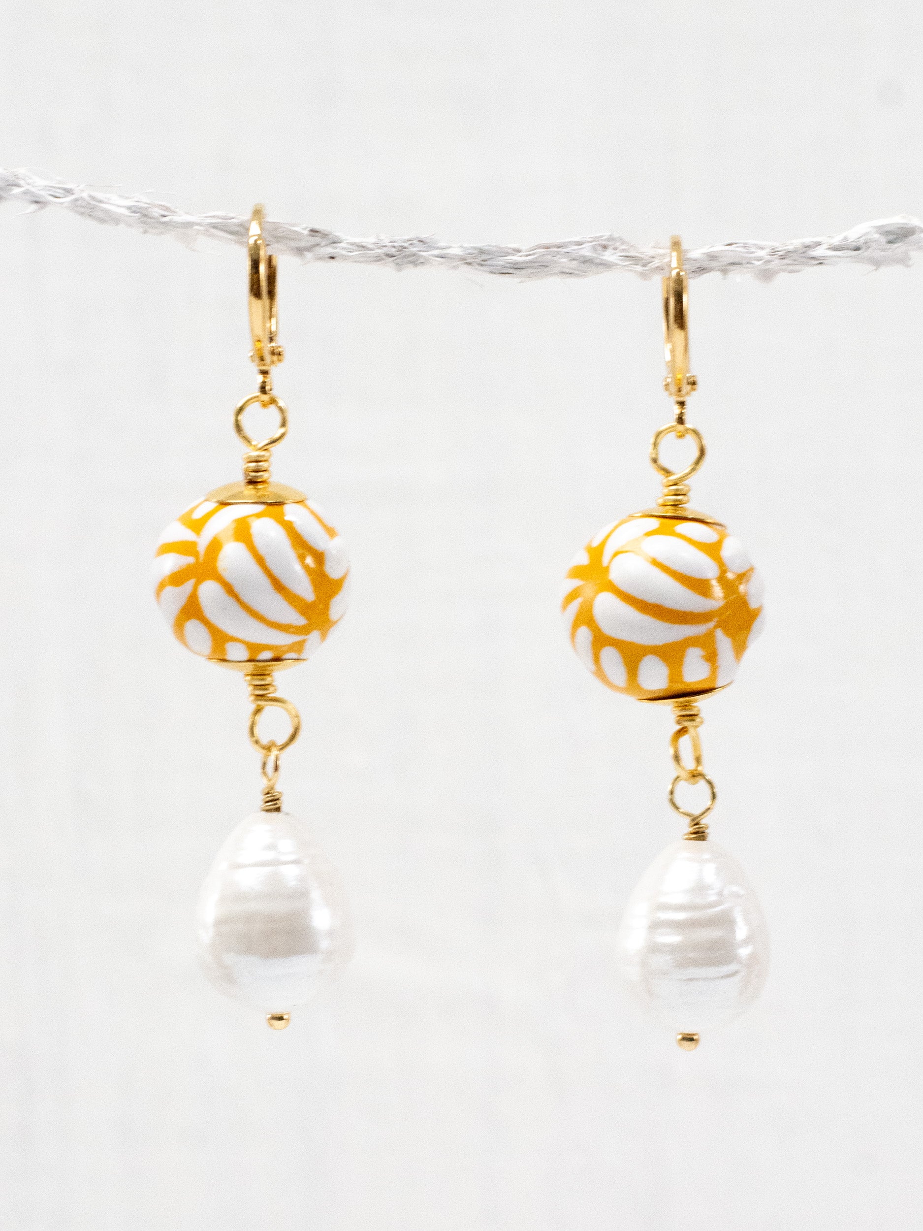 Aretes talavera esferas con perlas
