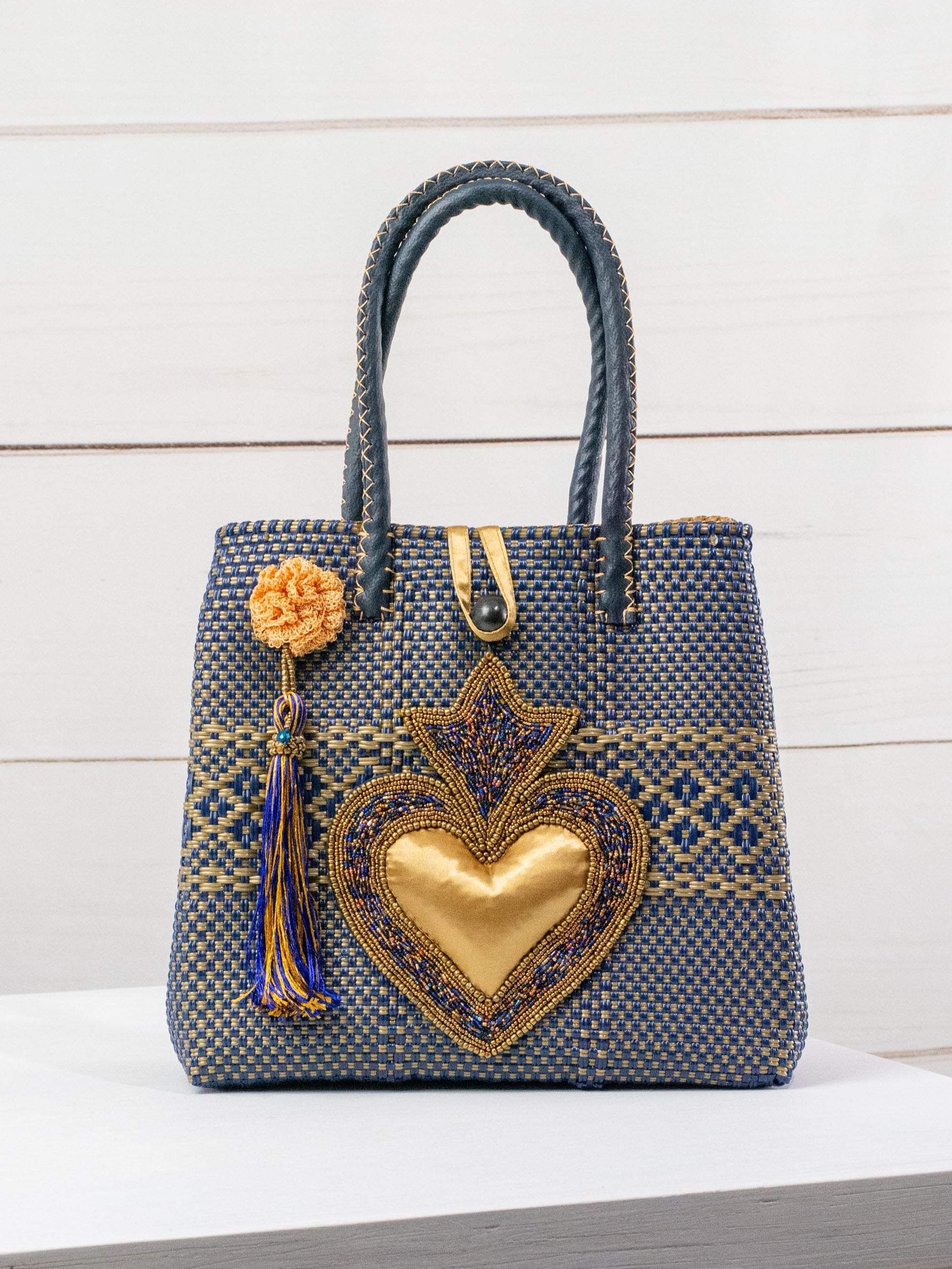 Medium heart milagro artisan bag with flower pompom