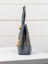 Medium heart milagro artisan bag with flower pompom