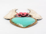 Winged heart with a flower