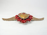 Double flamed winged heart with flowers and candelabra